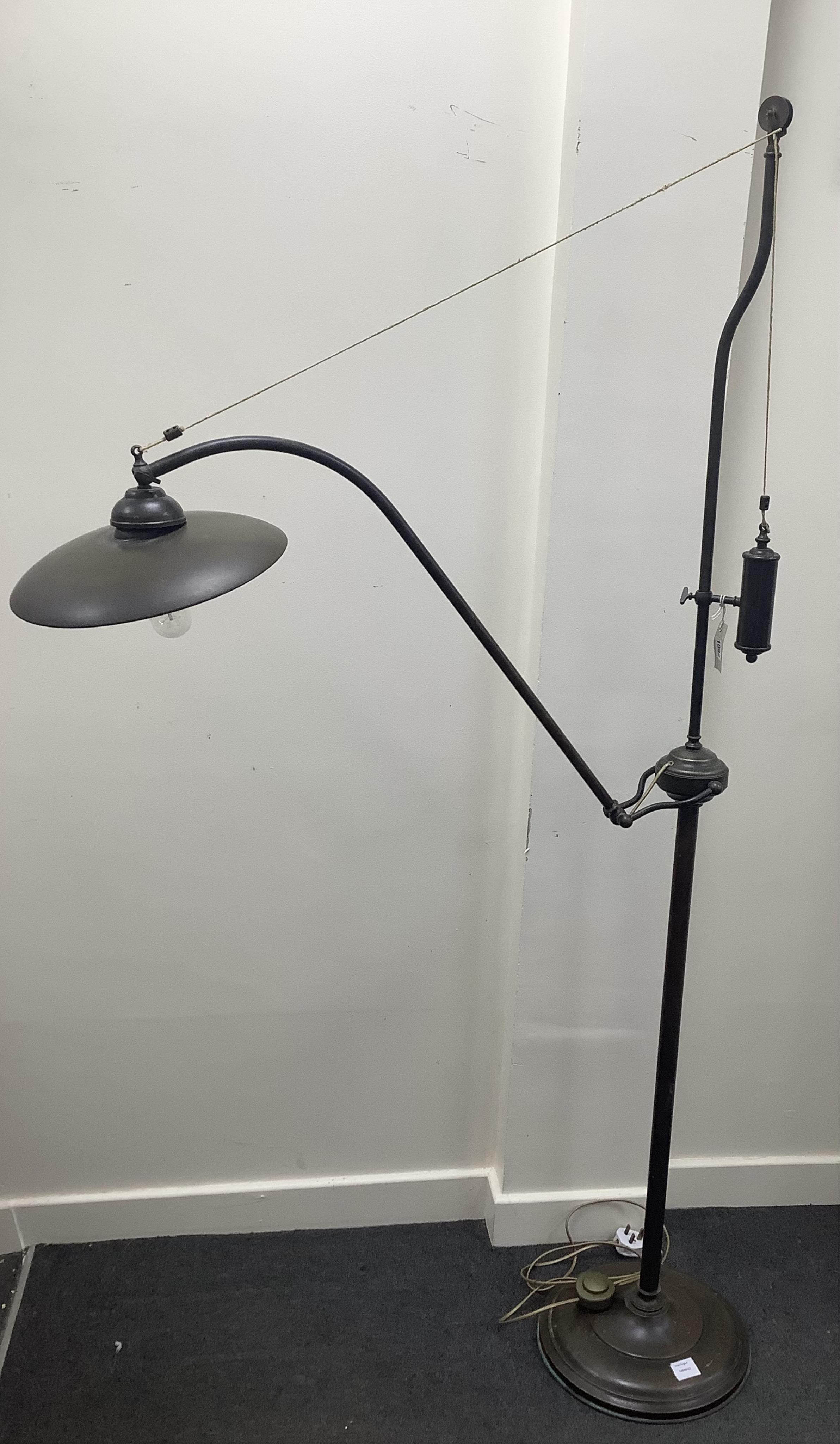 A pair of tall bronzed metal industrial style standard lamps, height 182cm. Condition - good